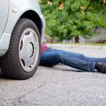 Dead pedestrian after a car accident in the street Dead pedestrian after a car accident in the street